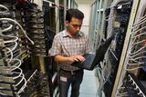 A computer engineer checks equipment at an internet service provider in Iran's capital, Tehran.