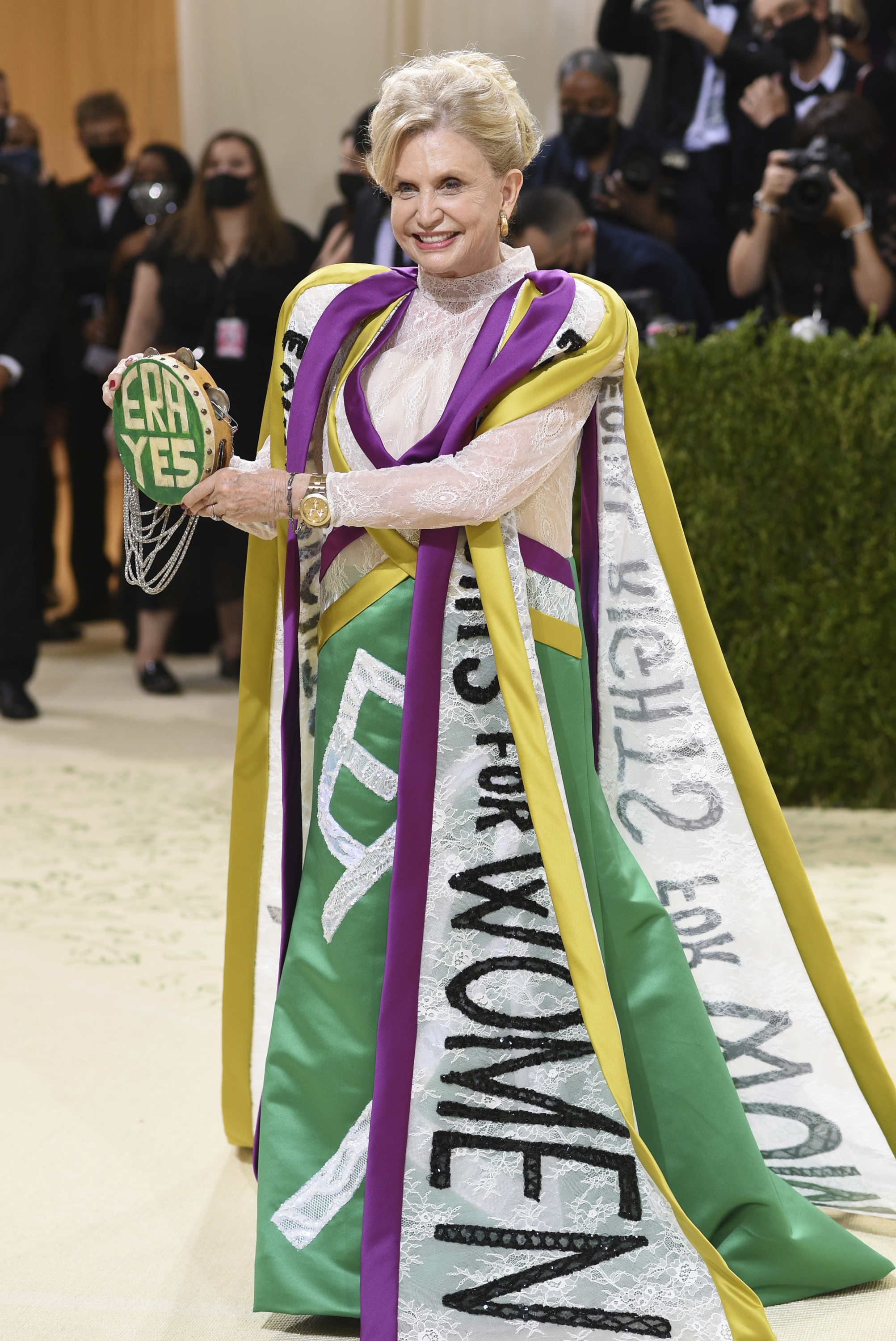 Carolyn B. Maloney wears a dress in tribute to votes for women.