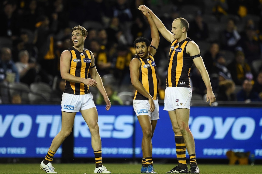 David Hale and Cyril Rioli celebrate a Hawthorn goal