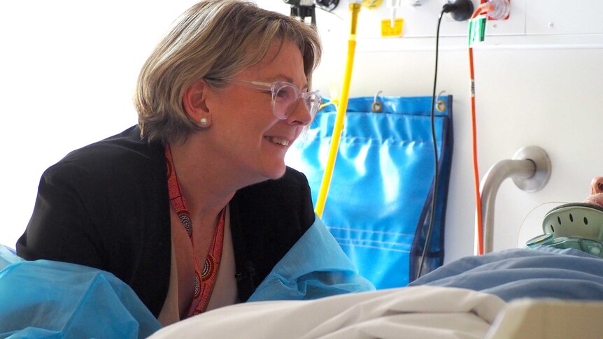 Dr Sally Williams attends to a patient.