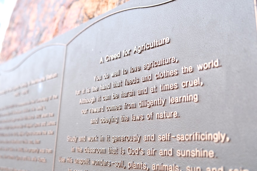 Wambiana stations creed for agriculture on a plaque on a rock