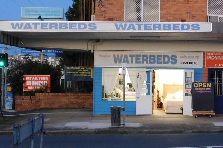 A shop with a sign saying "waterbeds".