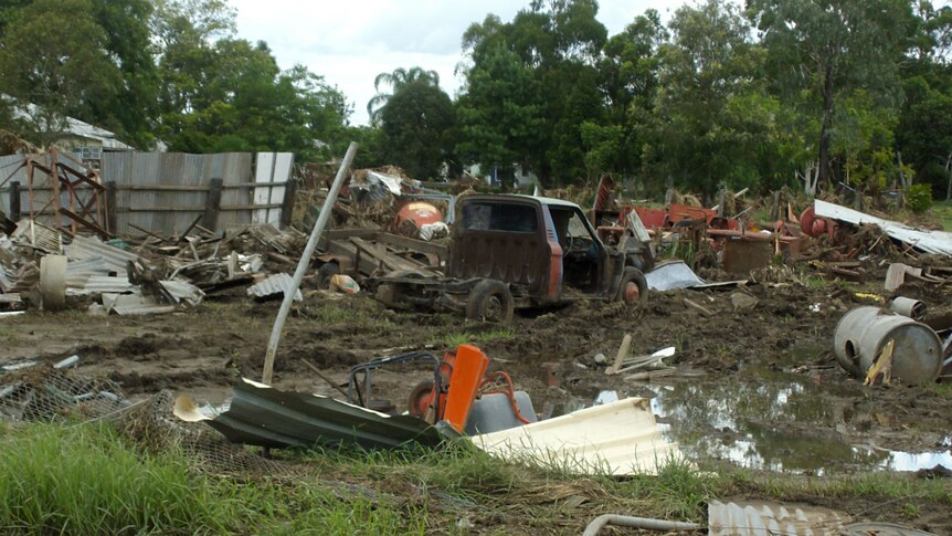 A destroyed vehicle and other possessions in Grantham on January 19, 2011, just over a week after deadly flash floods.