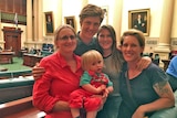 Elise Duffield (left) and Sally Amazon (right) with Tadhg and other family members