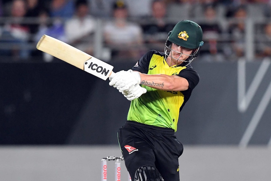 D'Arcy Short takes a big swing during a Twenty20 match against New Zealand.