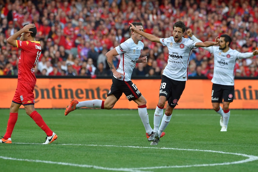 The Wanderers celebrate a goal by Scott Neville against Adelaide in the A-League grand final.