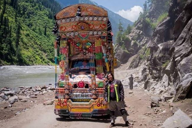 Zenith poses next to a truck in Kashmir