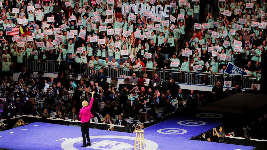 Senator Elizabeth Warren waves to a crowd of supporters.