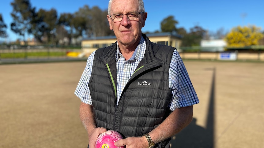 man holding bowling ball