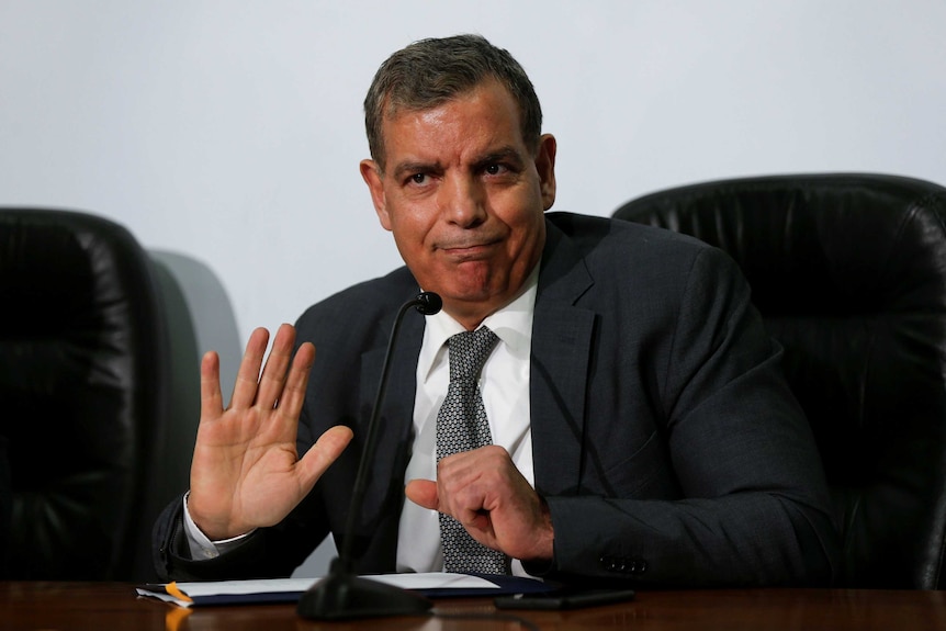 Saad Jaber waving during a press conference