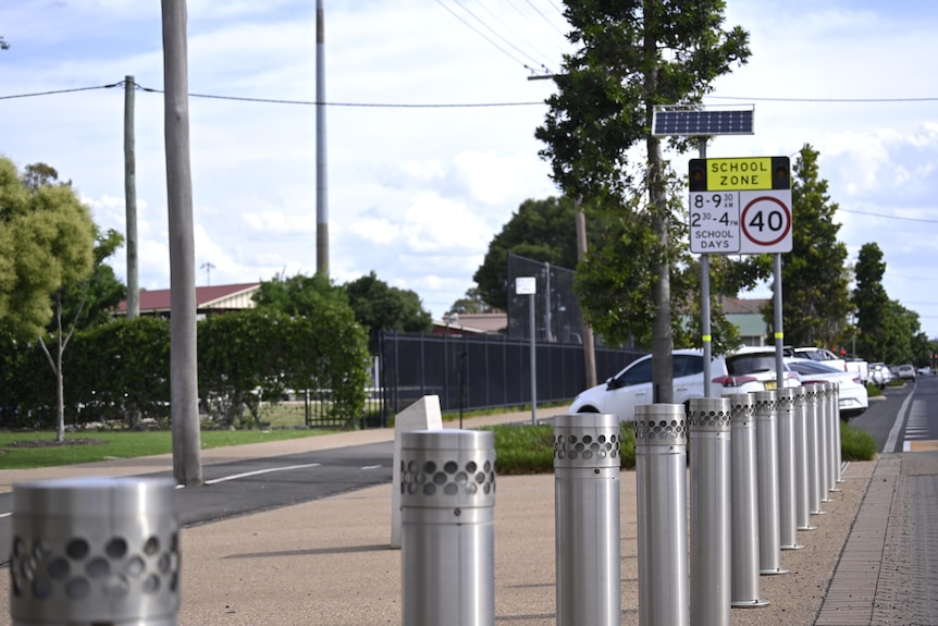 A school zone sign on a deserted street