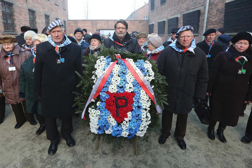 Holocaust survivors commemorate the people killed by the Nazis at the former Auschwitz Germany Nazi death camp in Oswiecim, Poland, Friday, Jan. 27, 2017