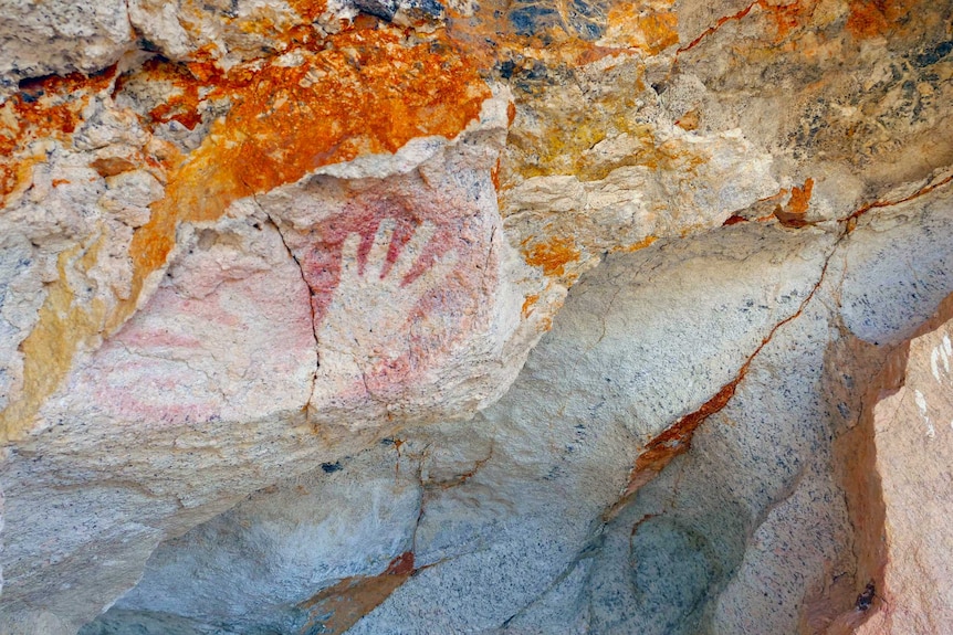 Aboriginal rock paintings of hands.