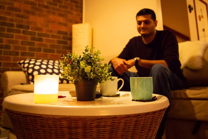 Raj Zaveri is sitting in his living room with two cups of coffee.