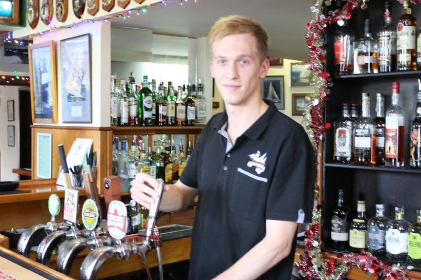 Shipwrights Arms General Manager Andrew MacAskill pours a beer in the front bar