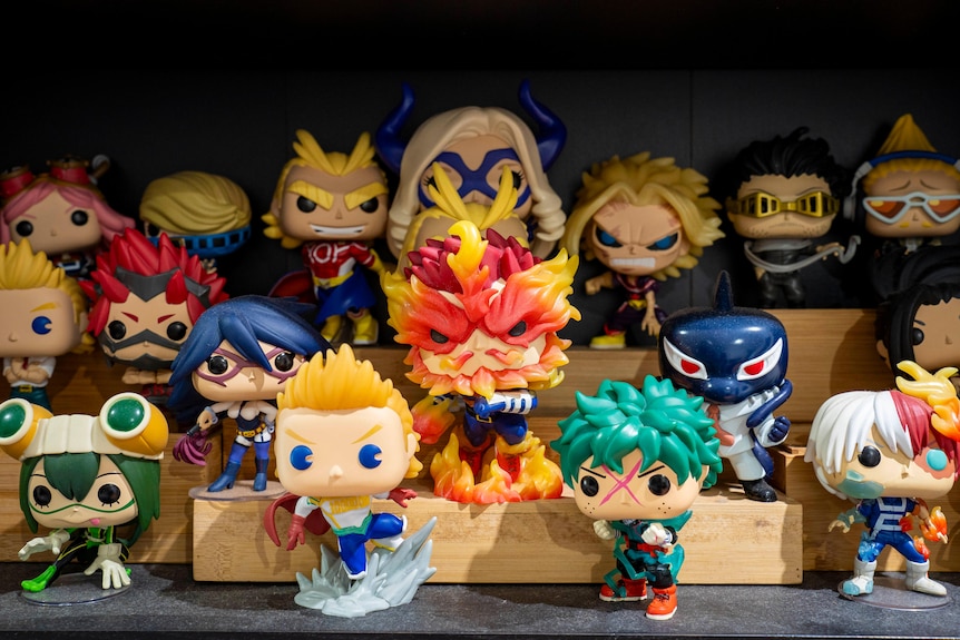 pop vinyl figurines on display including characters from My Hero Academia
