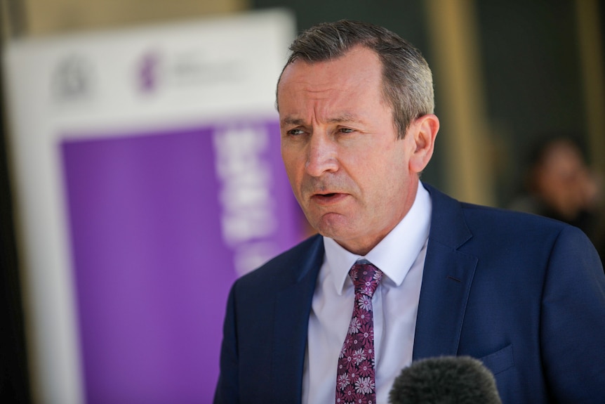 WA Premier Mark McGowan speaks at a media conference wearing a suit and tie.