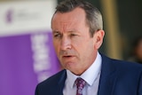 WA Premier Mark McGowan speaks at a media conference wearing a suit and tie.