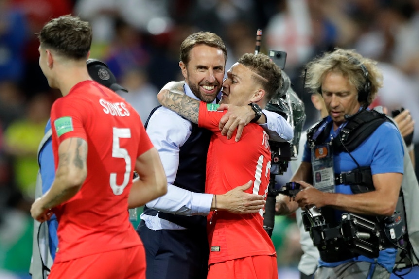 England's Kieran Trippier embraces coach Gareth Southgate