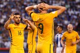 The Socceroos react to a missed Tomi Juric chance