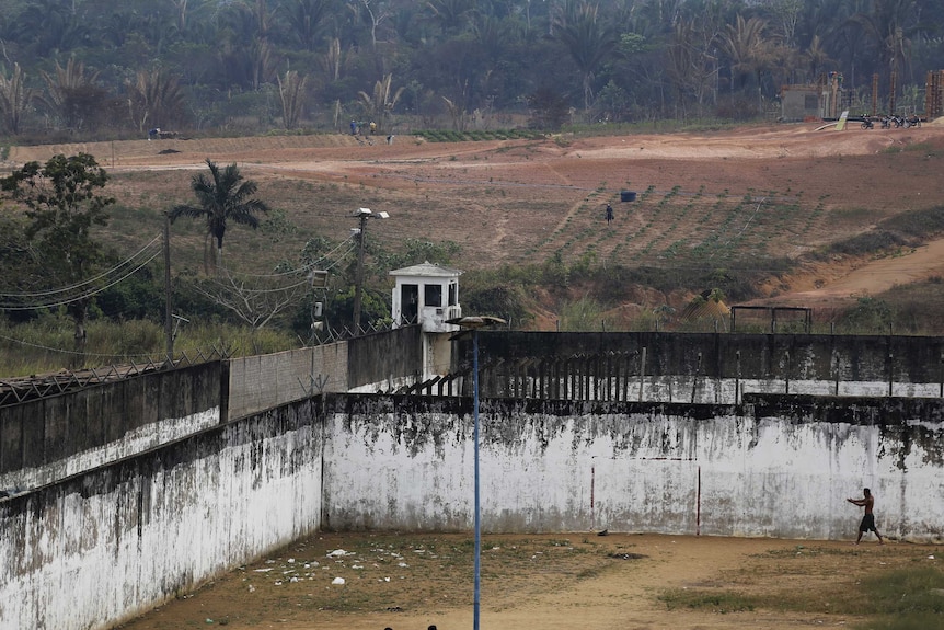 An inmate walks through a prison courtyard in Rondonia State, Brazil.