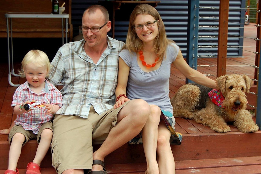 Kate and Paul Torney with their child