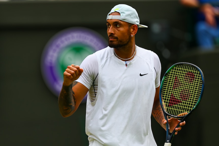 Nick Kyrgios pumps his fist.