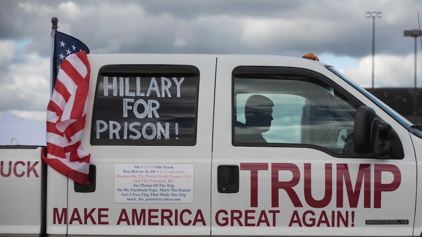 Mark Hoffman of Newark, Ohio, sits in his truck in a parking lot prior to a campaign stop by Donald Trump.