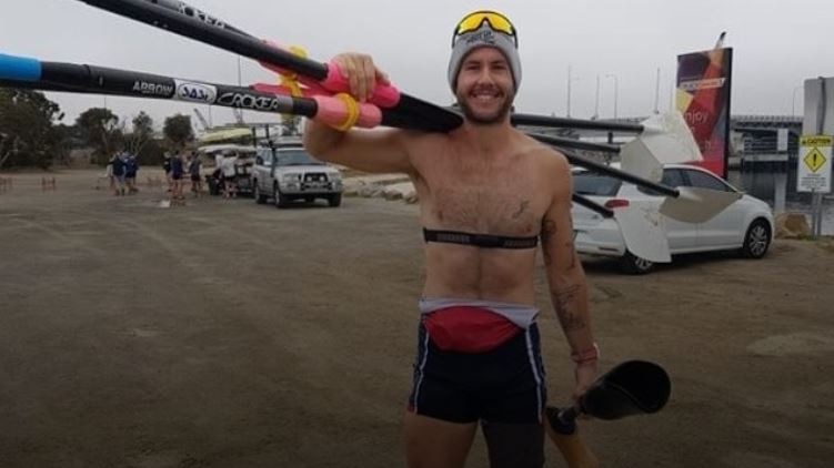 Adelaide para-athlete Jed Altschwager holding his prosthetic leg.