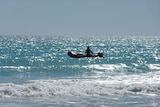 A man using a rubber boat off Broome's Cable Beach.