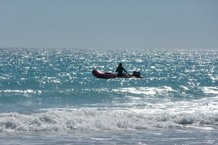 A man using a rubber boat off Broome's Cable Beach.