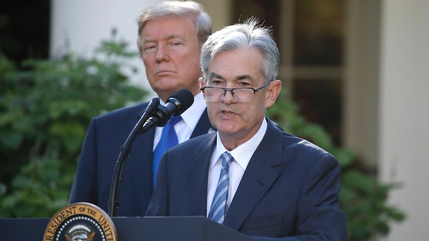Trump stands behind Powell as he addresses media