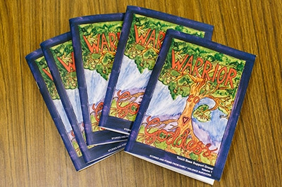 The image shows copies of the Warrior to Goddess book.