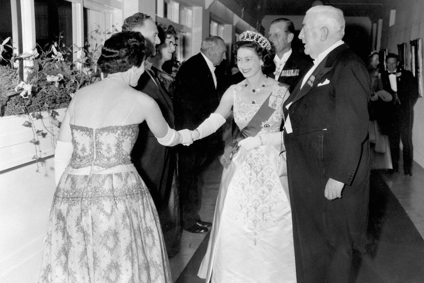 A guest is presented to Queen Elizabeth II at a state reception at Parliament House.