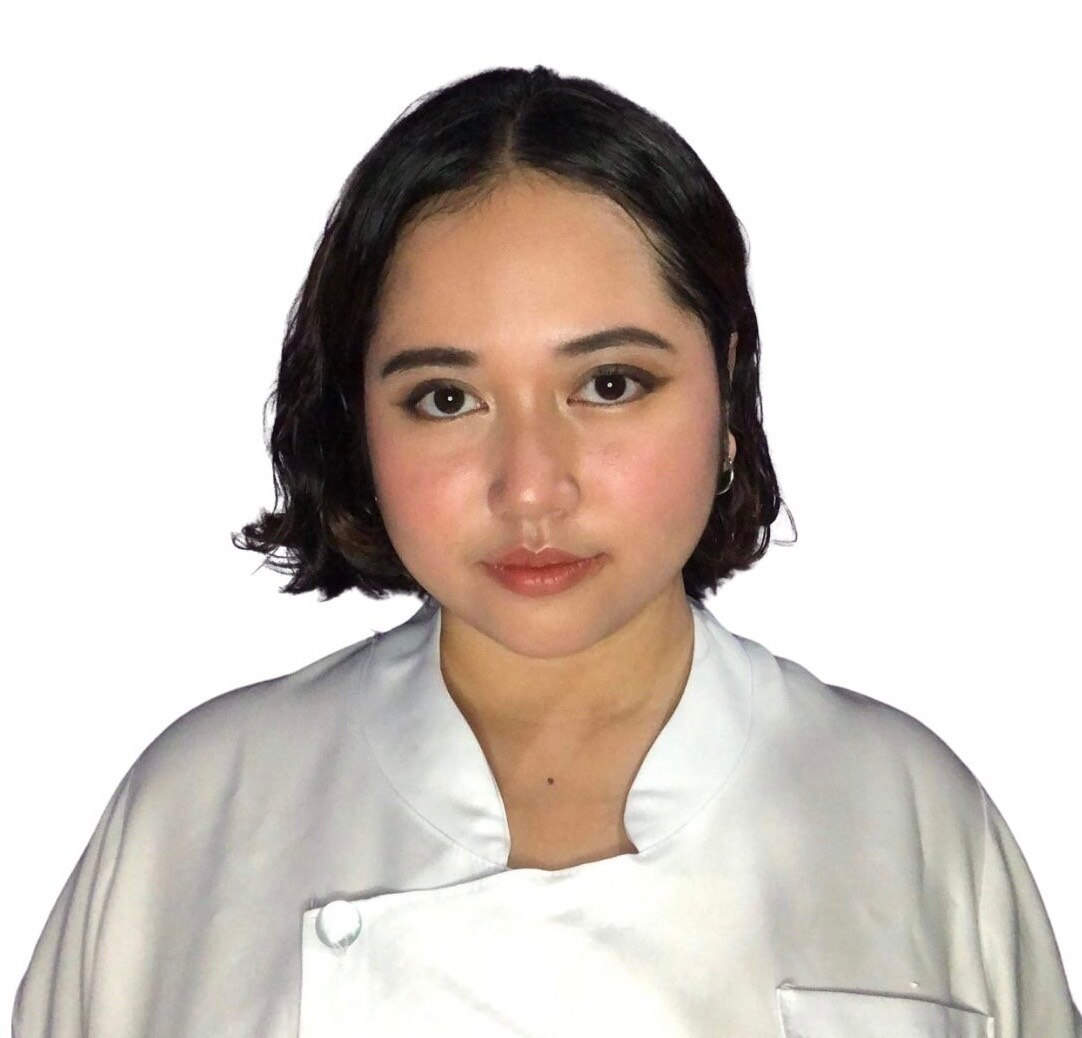 a young woman looks at the camera. 