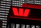 Westpac Bank logo on a tall office tower.