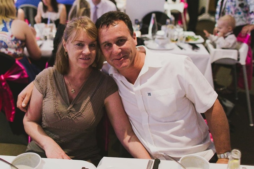 Michael and Tracie Pel sitting together at a family wedding in 2014.