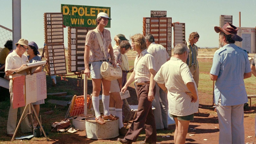 Archival image of Wittenoom residents at the racecourse, c. 1975.
