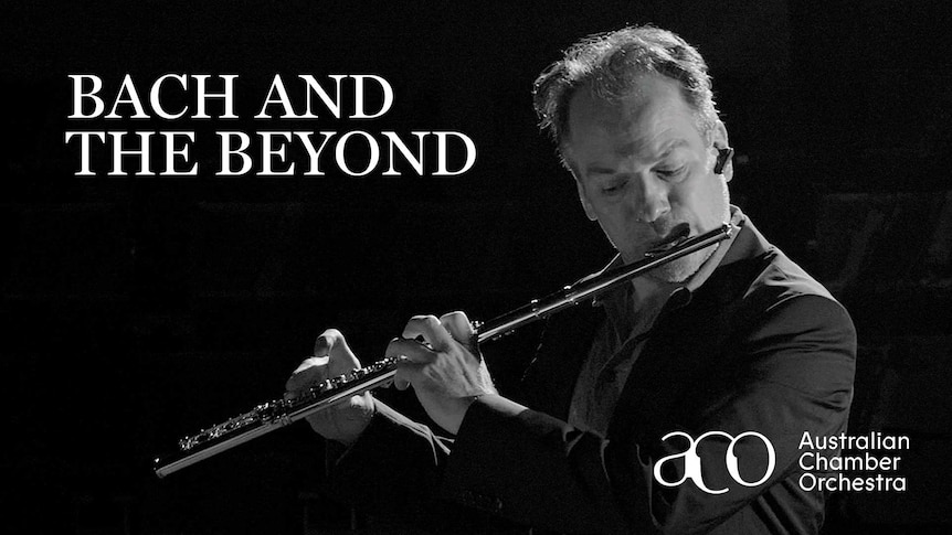 Black and white image of a man playing a flute