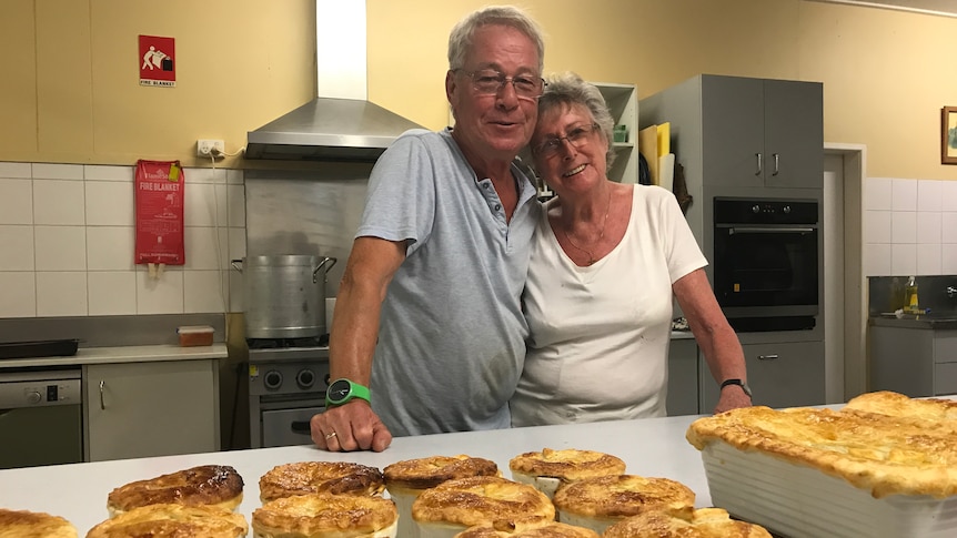 Jens and Anita Steffen with homemade pies in the kitchen.