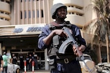 A soldier stands guard in front of Splendid Hotel in Ouagadougou, Burkina Faso, January 17, 2016.