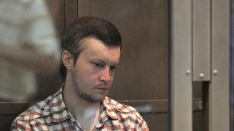 No remorse: Alexander Pichushkin sits behind steel bars in the Moscow court (File photo)