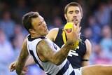 Geelong's Mitch Clark takes a mark in front of Carlton's Kristian Jaksch at Docklands.