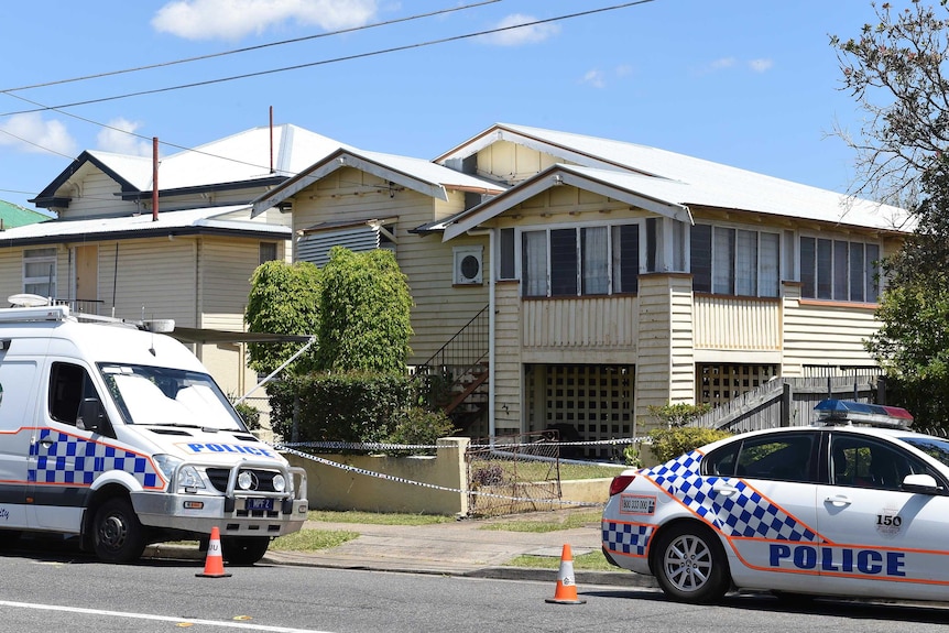 Police vehicles outside the home of Danielle Miller in Greenslopes, Brisbane.