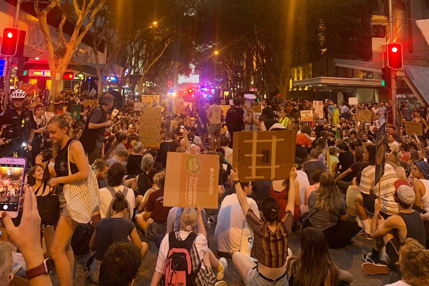 Protesters march down Adelaide Street in Brisbane climate rally on January 10, 2020.