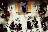 Overhead view of an orchestra conductor