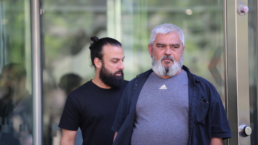 The father of Kaya brothers, Haci Kaya, walks out of court.