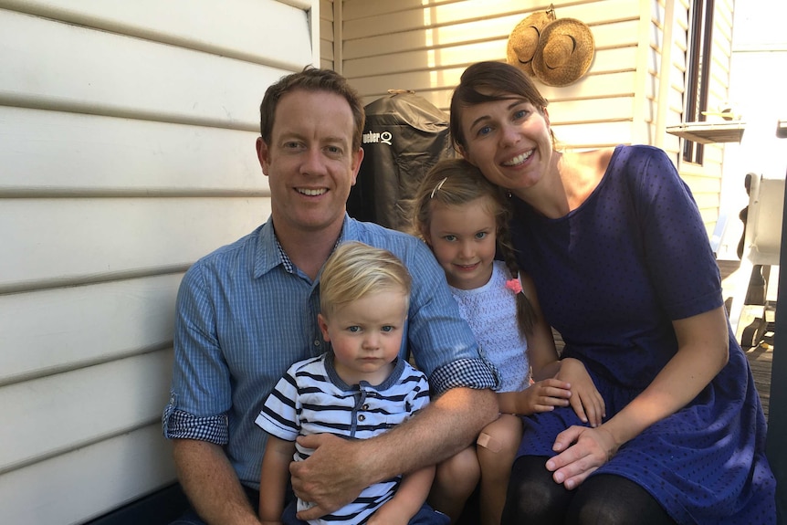 A Melbourne family smiles for a portrait