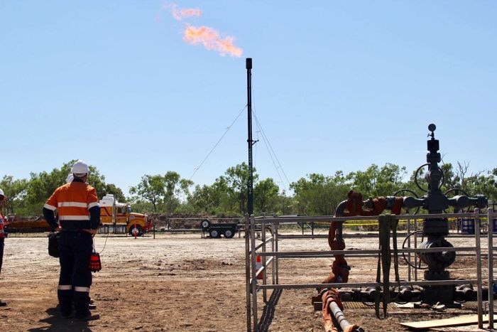 A flame spurts out from a gas well in Amungee.