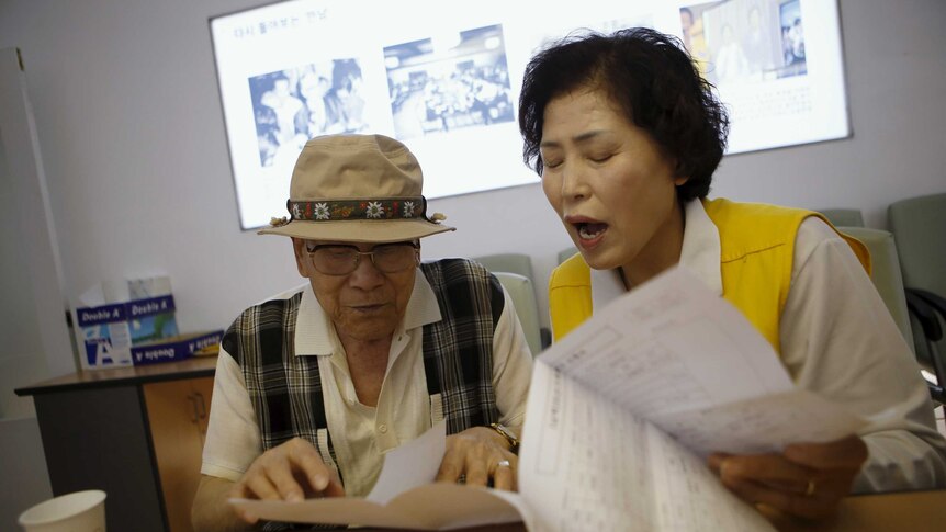 A South Korean man gets documents prepared
